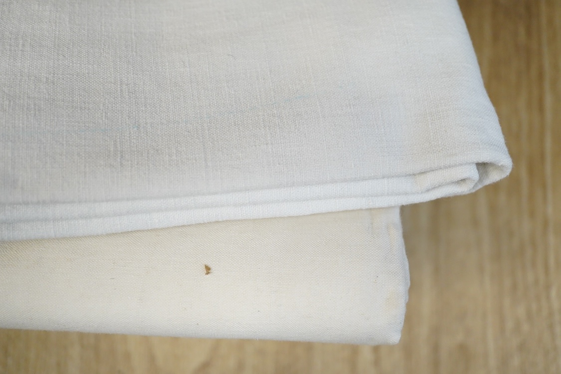 Thirteen mixed French mostly coloured provincial linen sheets some embroidered with monograms, floral embroidery, or decorated with crochet.